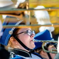 Member of GV marching band playing trumpet
